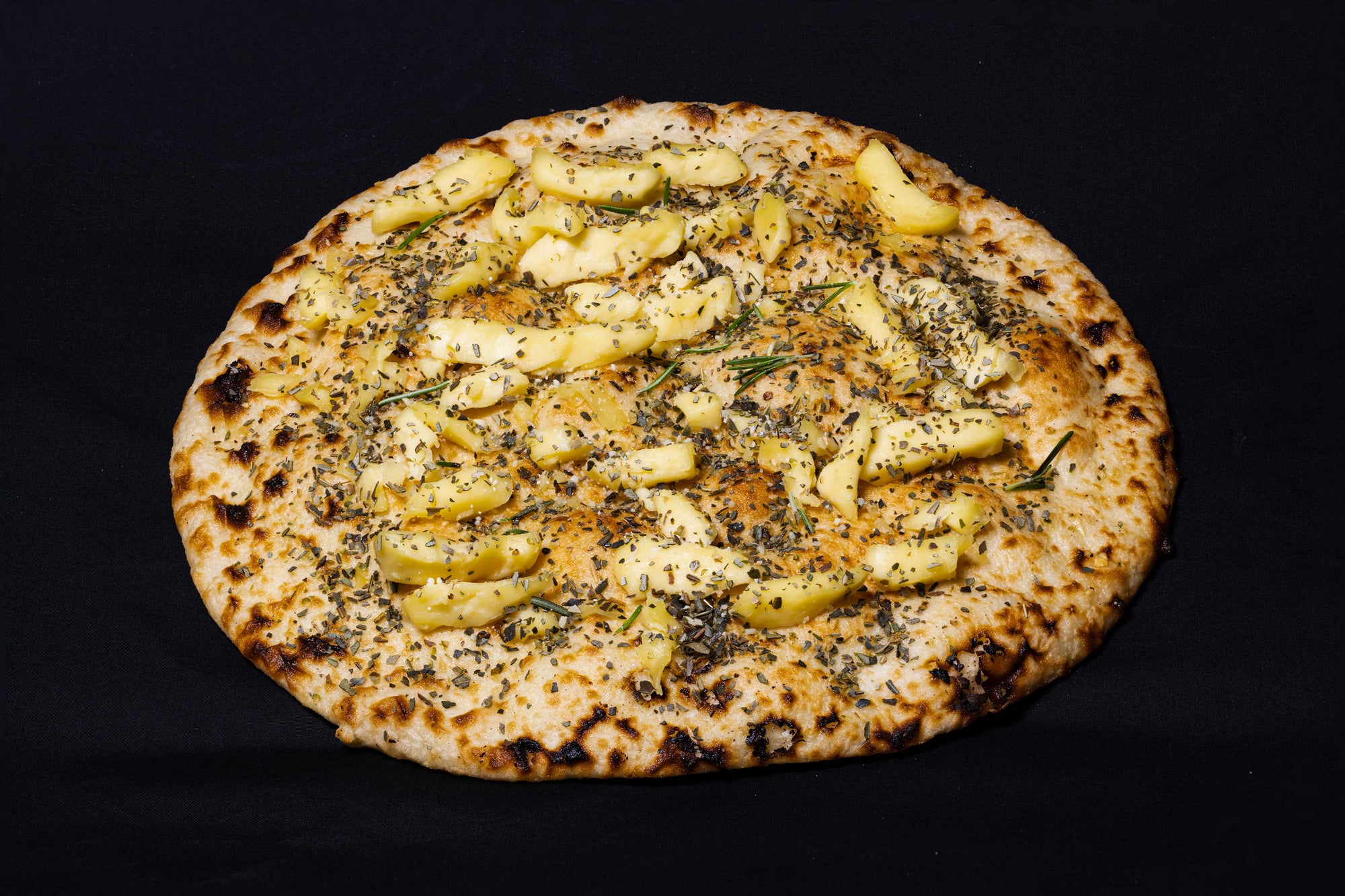 Single fresh pizza bade topped with mozzarella cheese, oregano and rosemary
