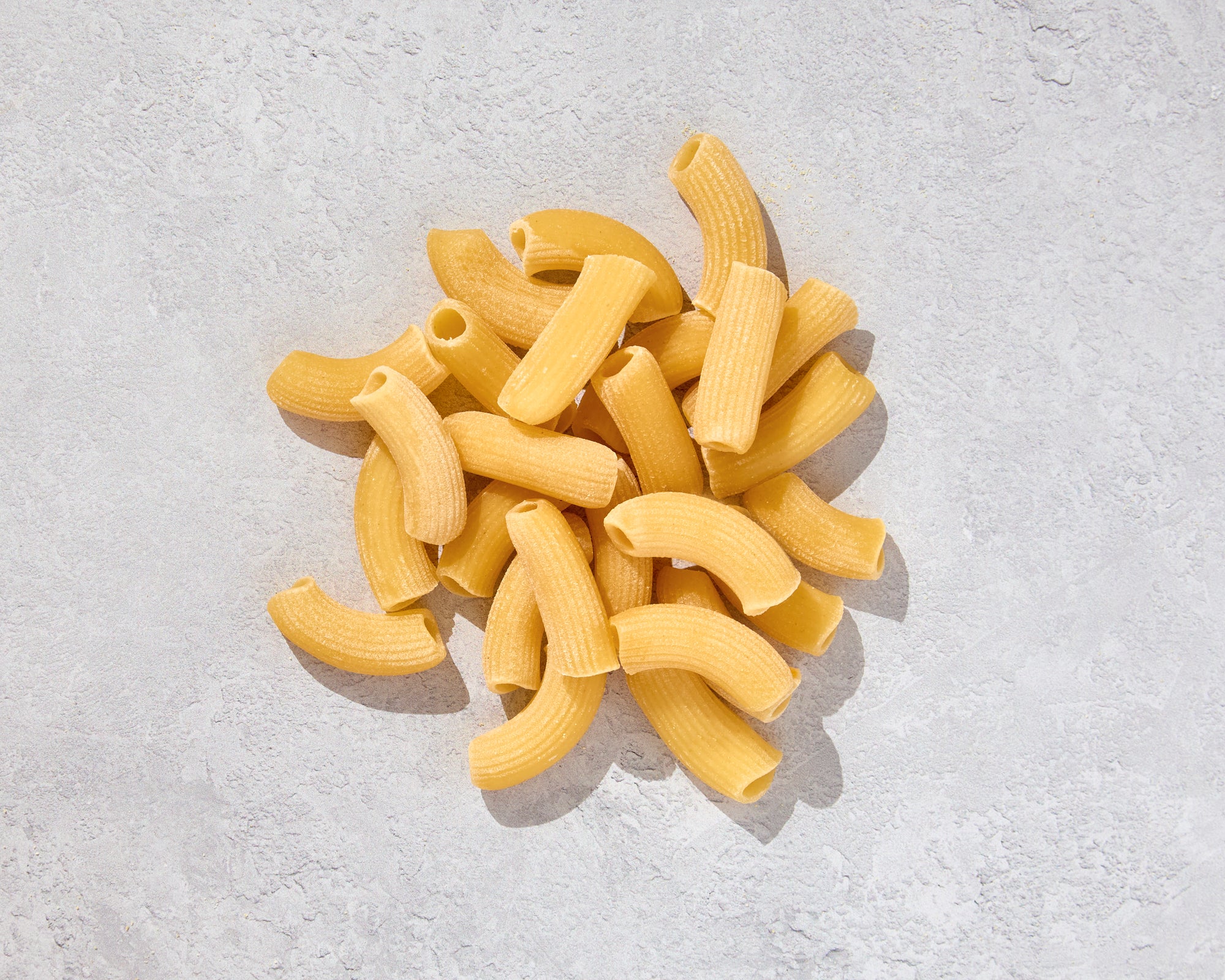 Pile of fresh rigatoni arranged to show texture